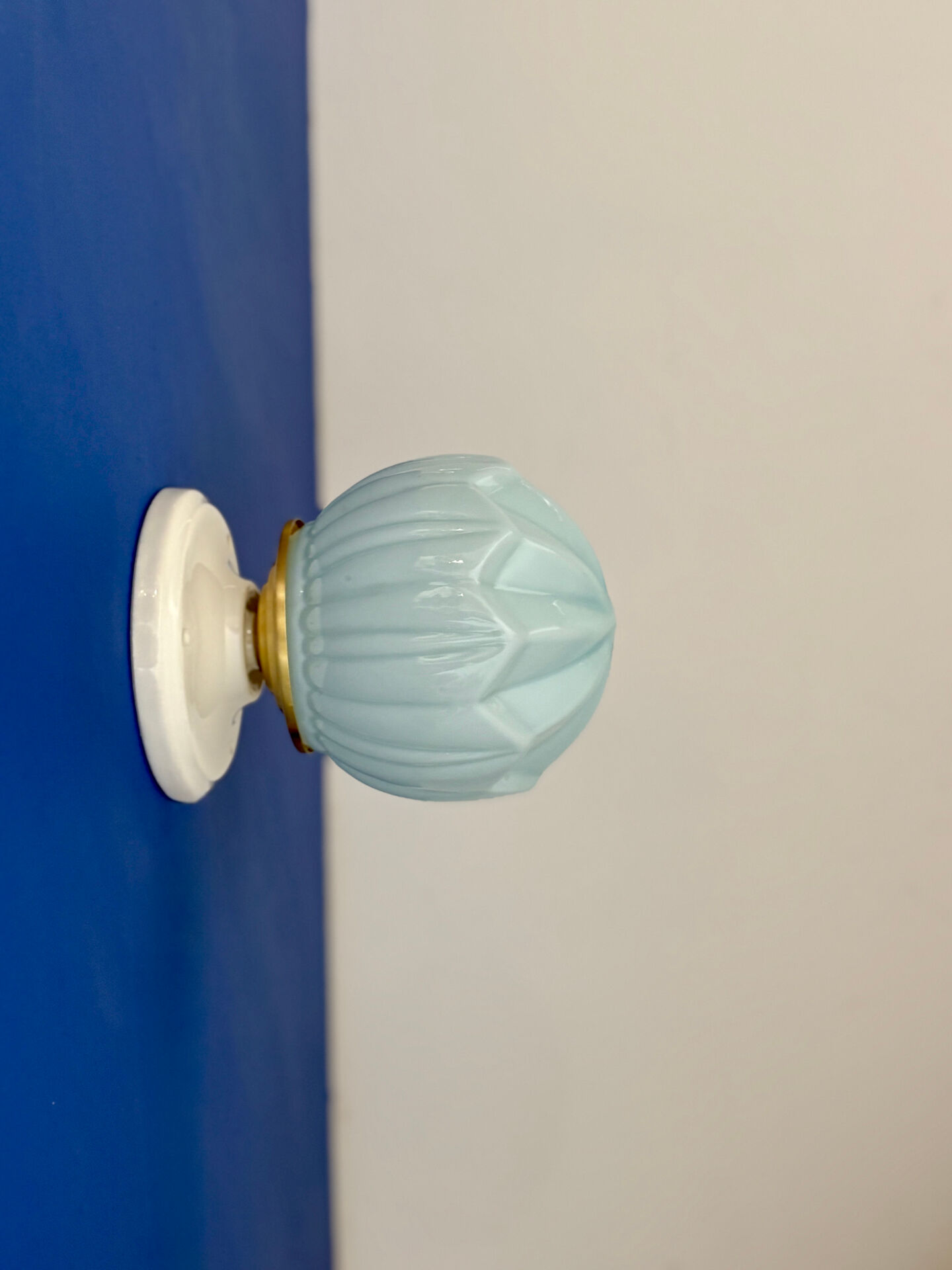 Vintage Art Deco globe wall light in blue opaline.