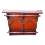 Bar counter in solid exotic teak wood; molded panel decor.