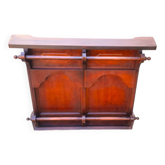 Bar counter in solid exotic teak wood; molded panel decor.