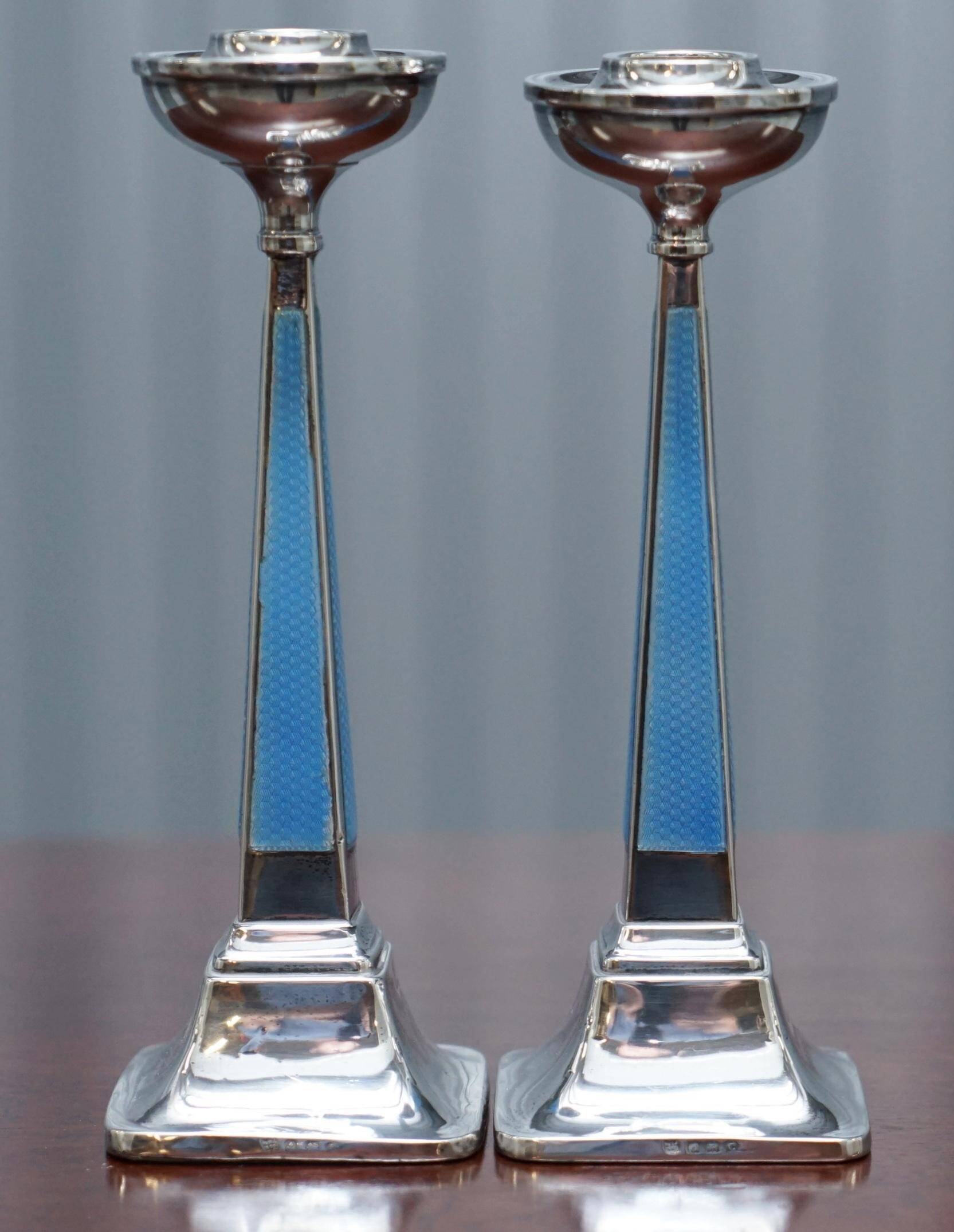 Pair of sterling silver and enamel candlesticks 1927 by Charles Green & Co.