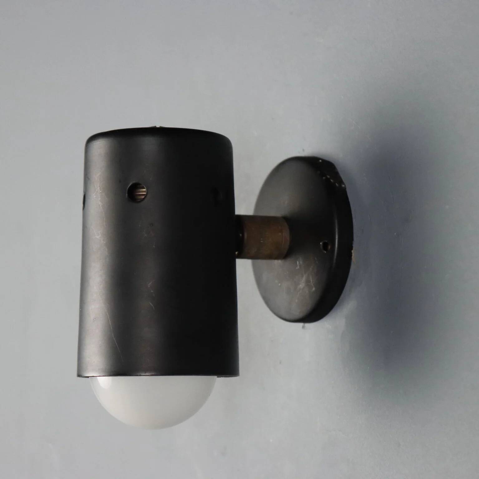 Adjustable black metal wall sconces from the 1960s.