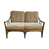 Two-seater rattan sofa with natural tones