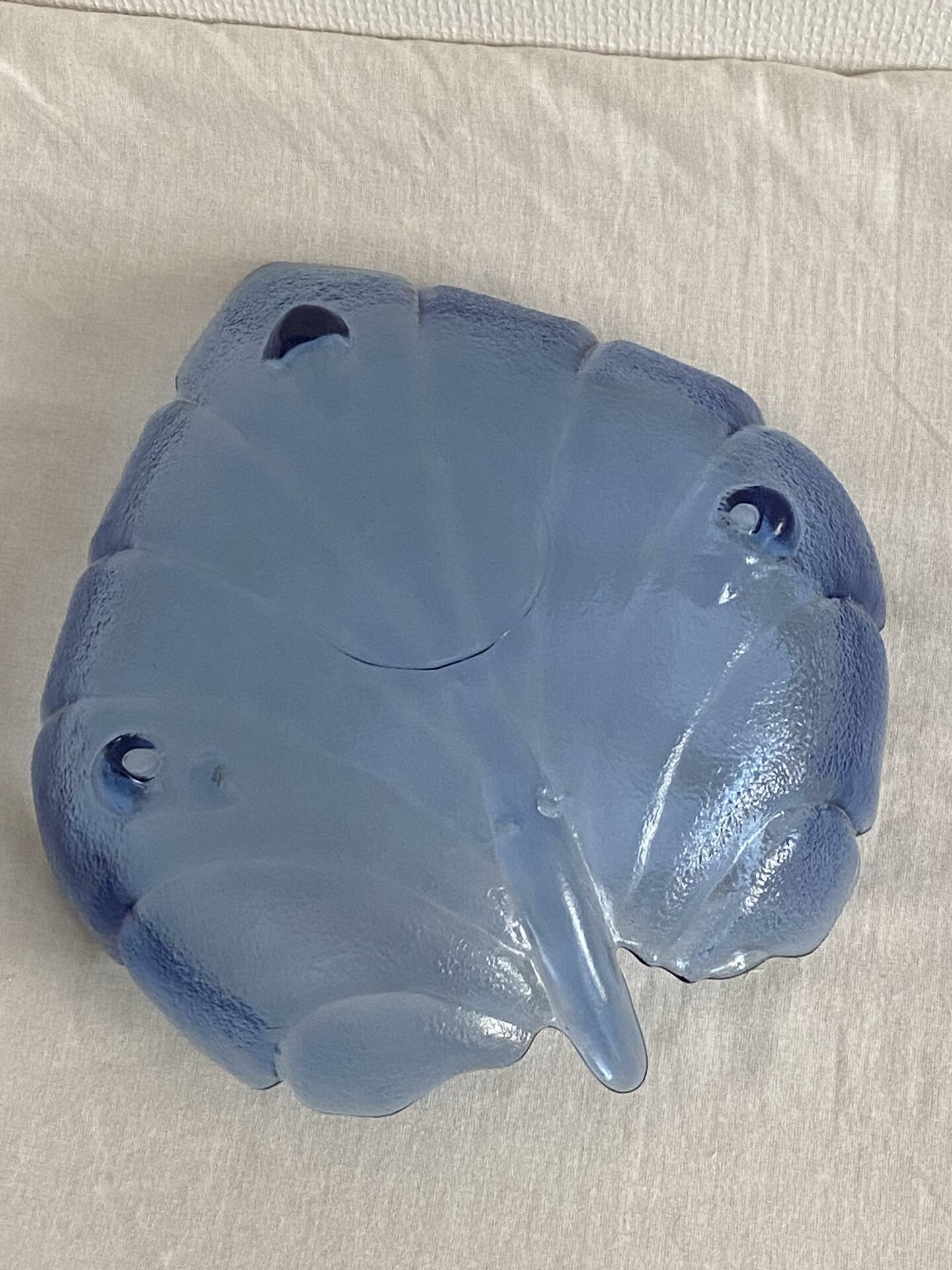 Large leaf-shaped fruit bowl, made of moulded blue glass.