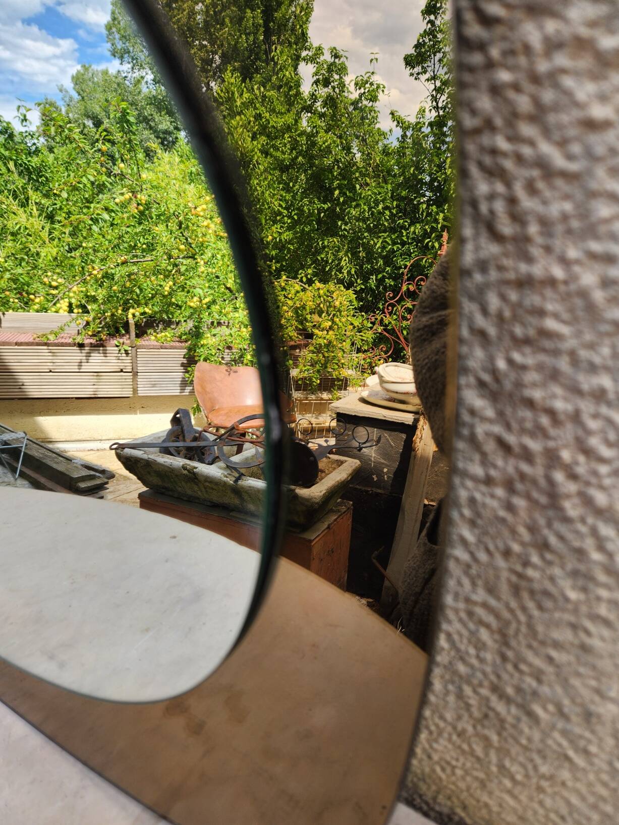 Vintage smoked bronze wall mirror, free form, 1970s – 70 x 55 cm