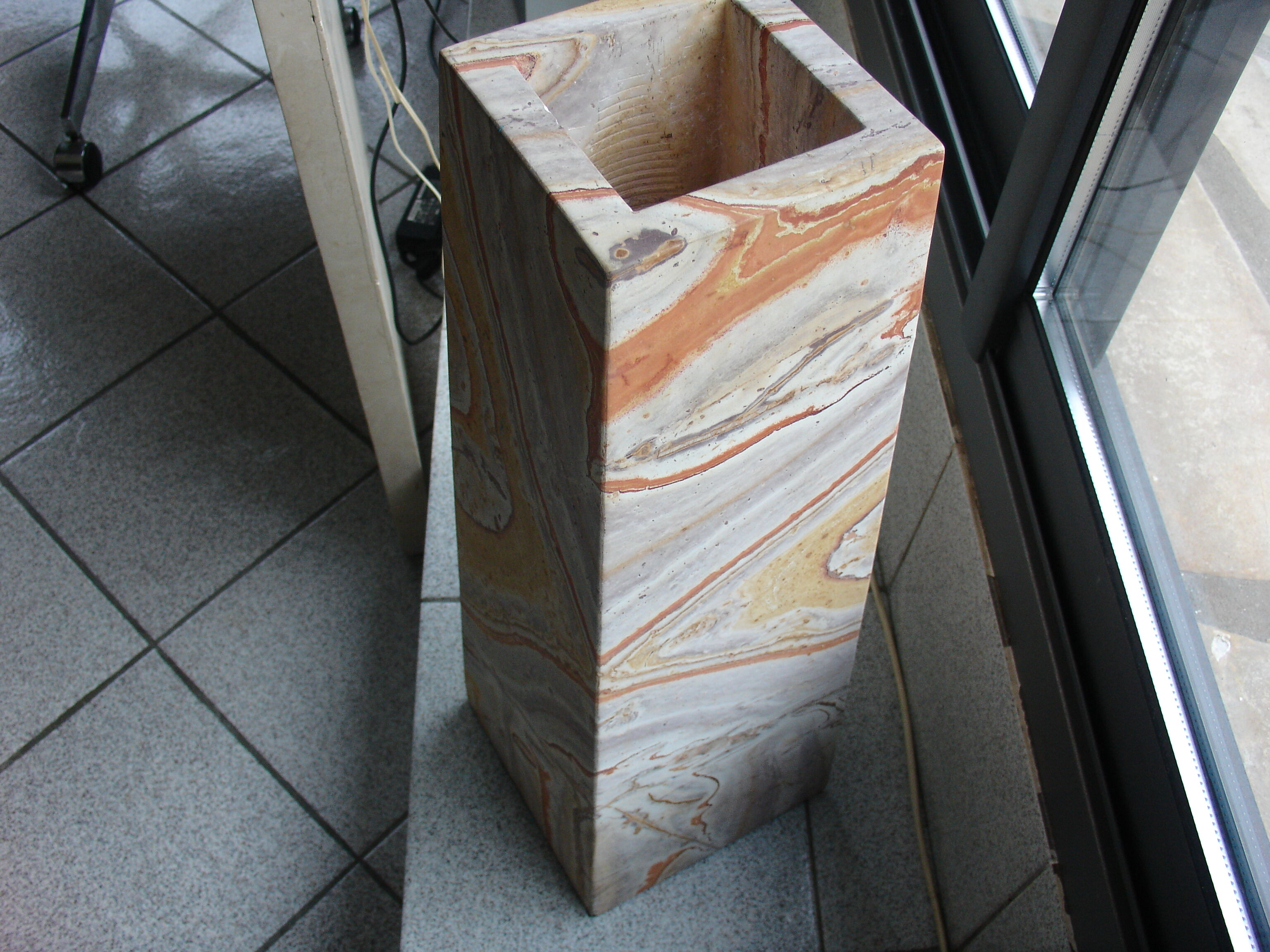 Floor vase in serpentine marble carved from a single block
