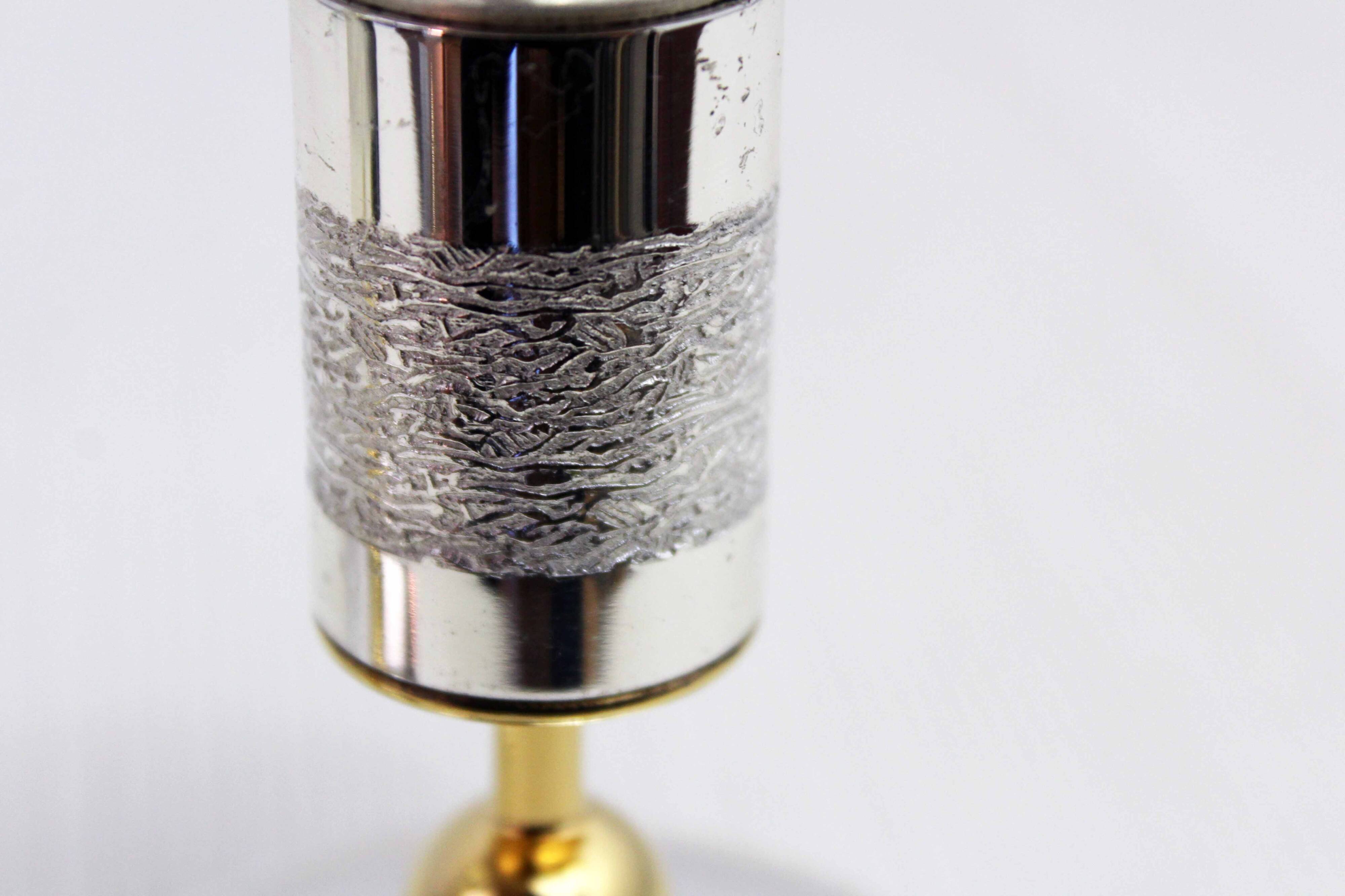 Pair of silver metal candlesticks