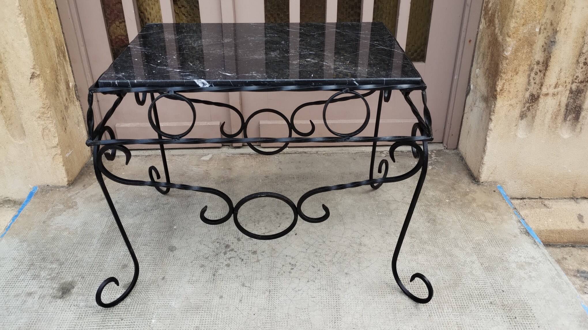 Wrought iron coffee table with black marble top