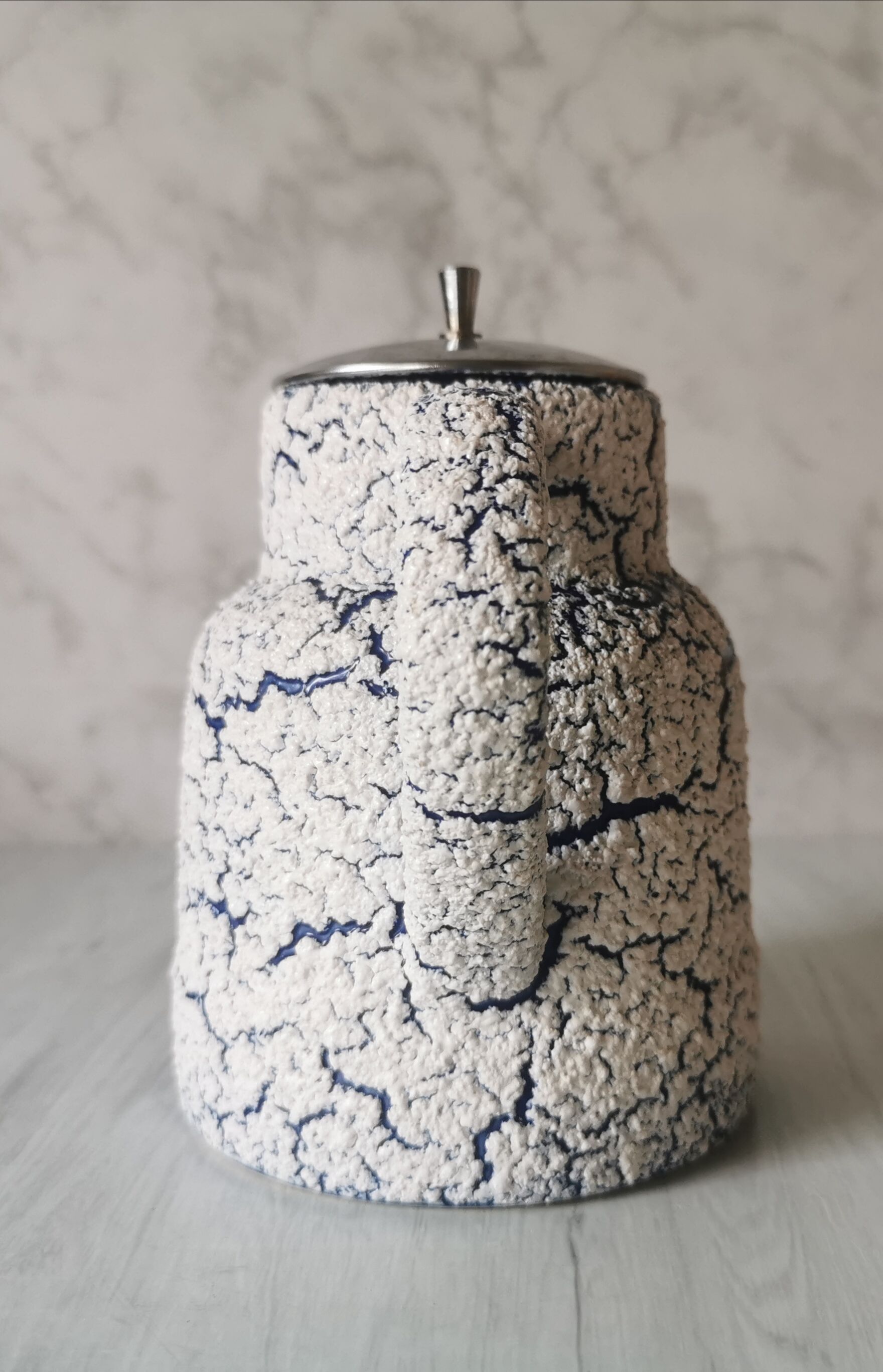 Cracked and enamelled ceramic teapot