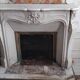 Louis XV style fireplace in veined white Carrara marble and XI ceramics.