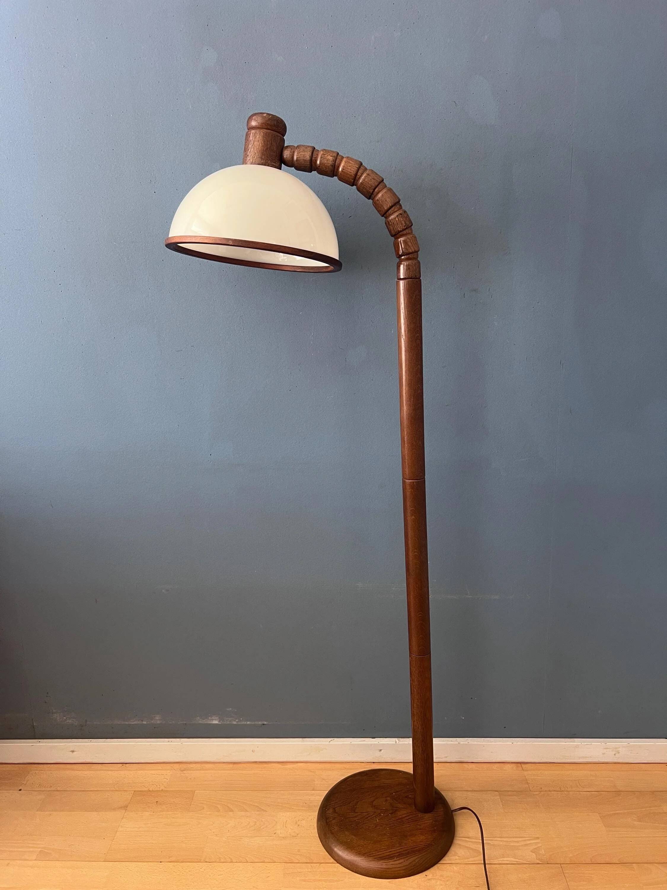 Mid-century floor lamp in brown wood by Steinhauer with an acrylic glass shade.