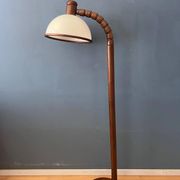 Mid-century floor lamp in brown wood by Steinhauer with an acrylic glass shade.