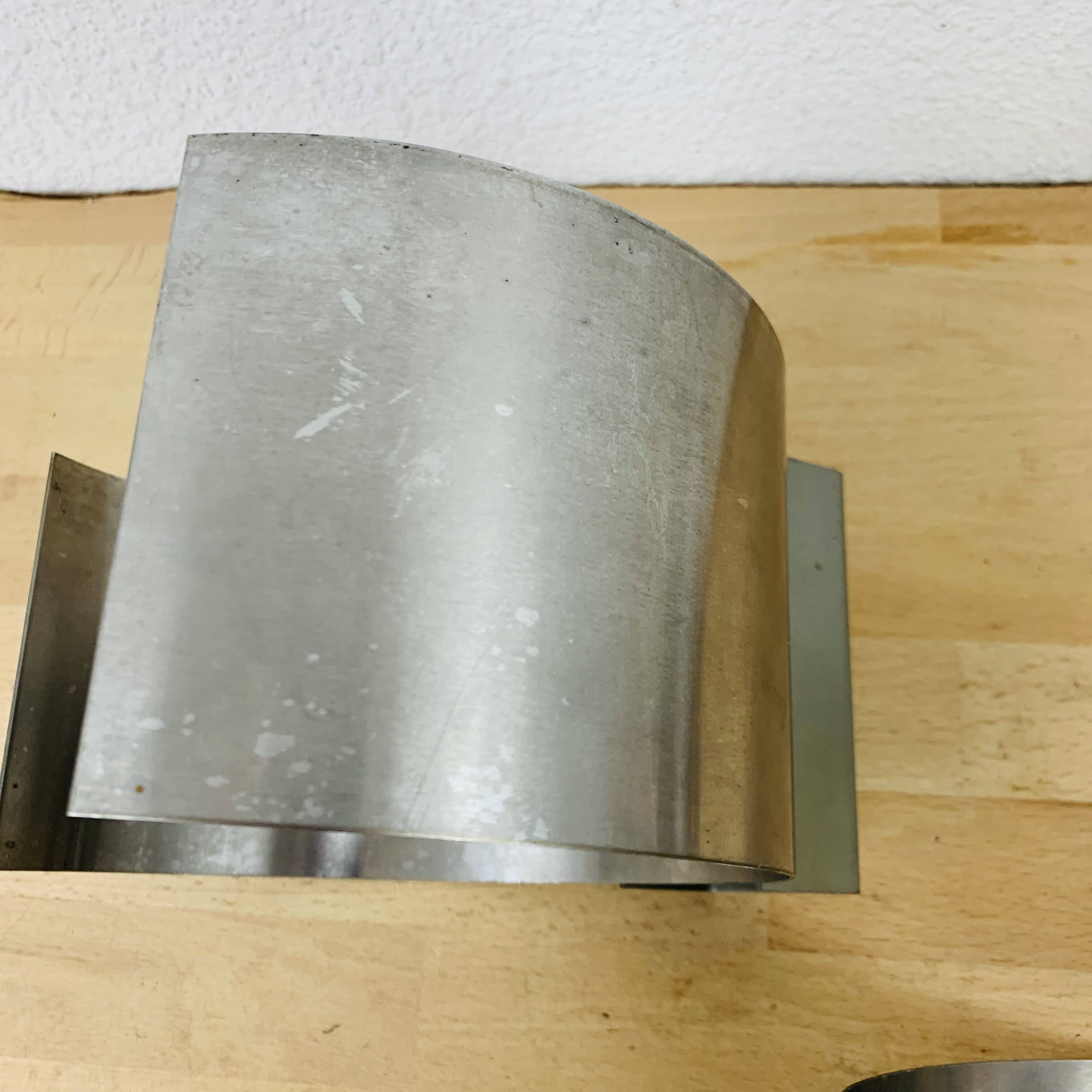 Pair of 70's brushed aluminum space age wall lights