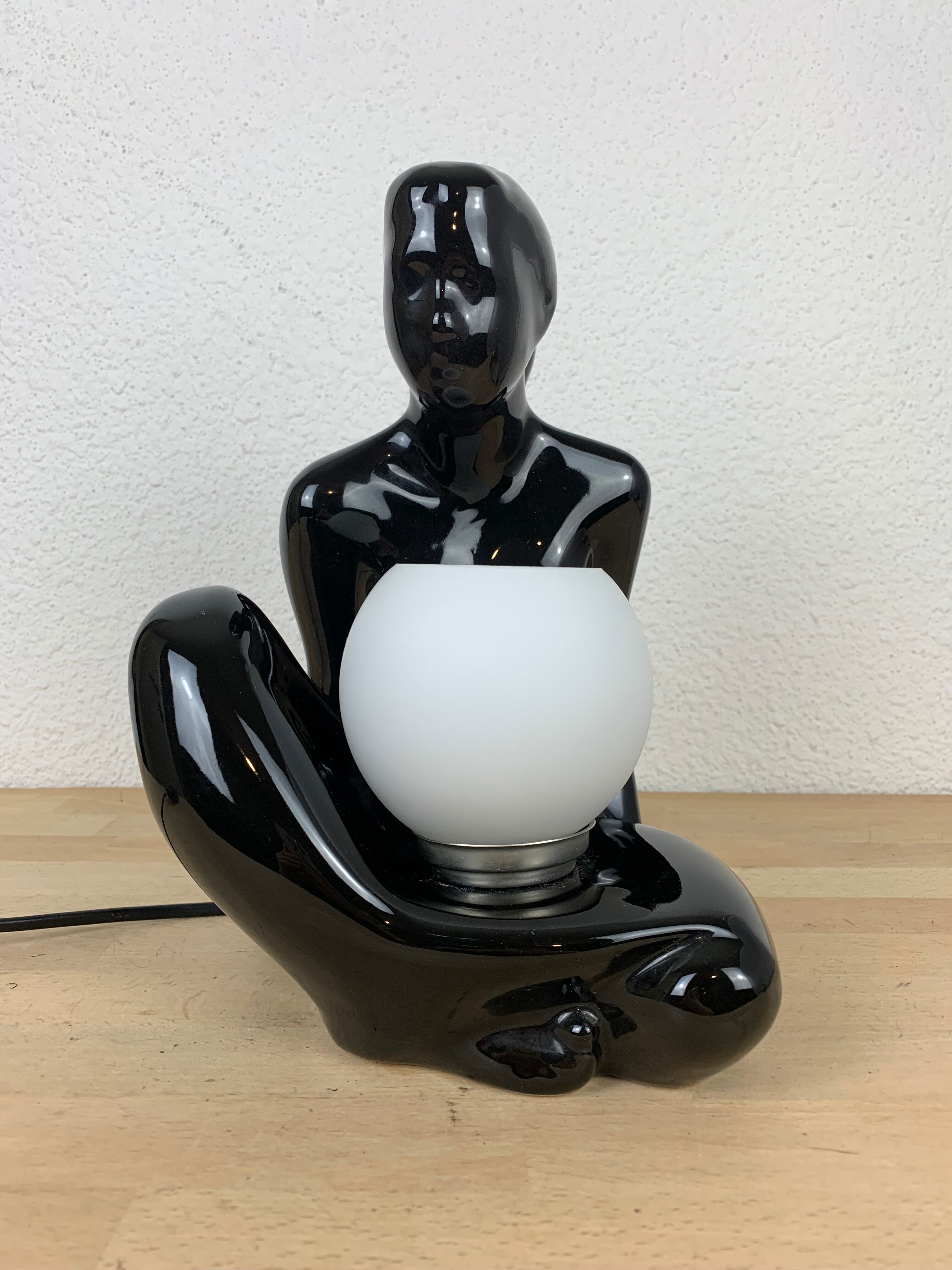 Black ceramic lamp and opal globe