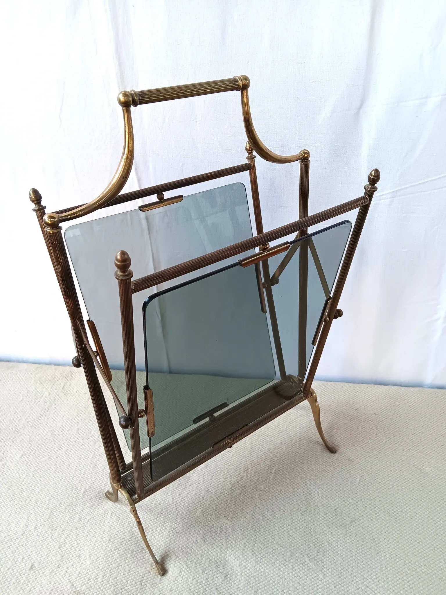 Neo-classical brass magazine rack in the spirit of Maison Jansen.