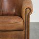 Aged sheepskin clubchair with beautiful vintage patina and comfortable seat