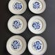 Set of 6 vintage dessert plates with blue patterns.