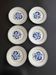 Set of 6 vintage dessert plates with blue patterns.