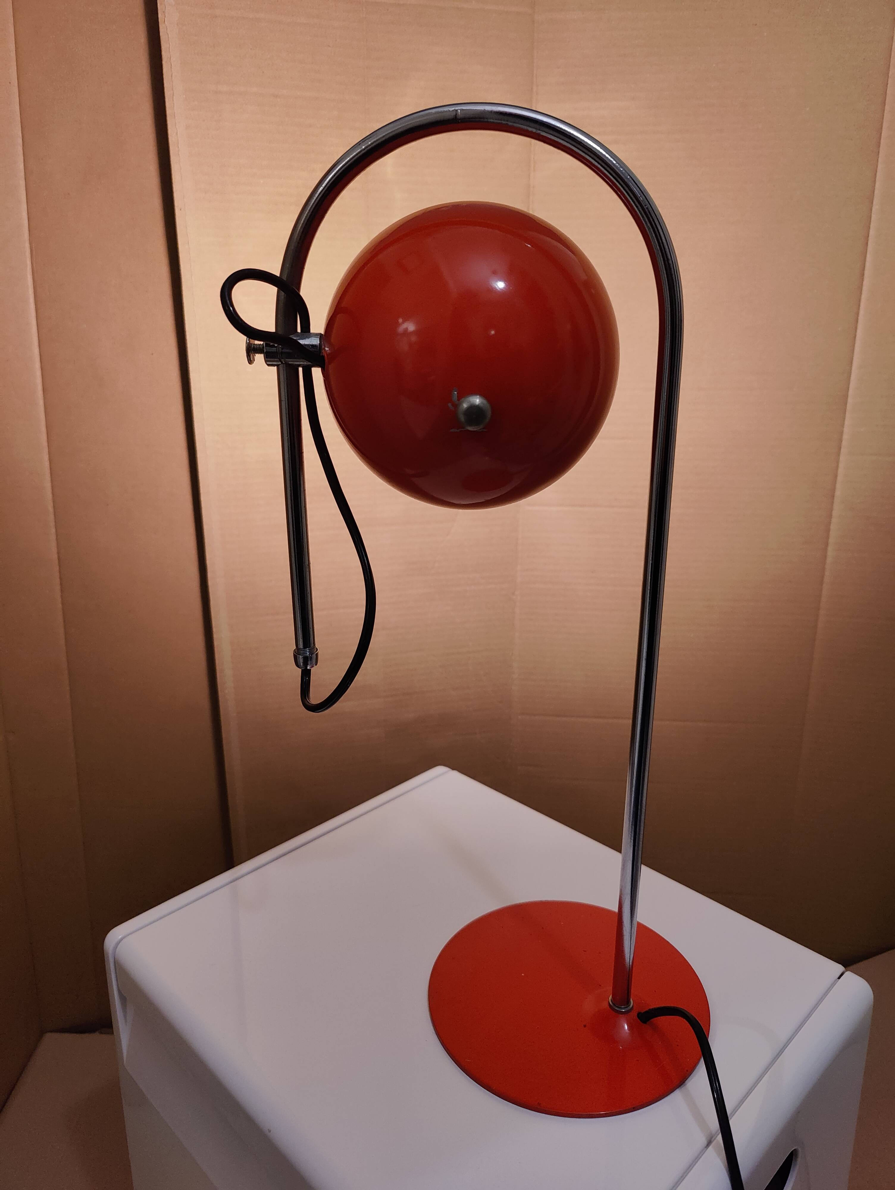 Eyeball space age orange desk or bedside lamp on an arc base