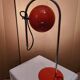 Eyeball space age orange desk or bedside lamp on an arc base