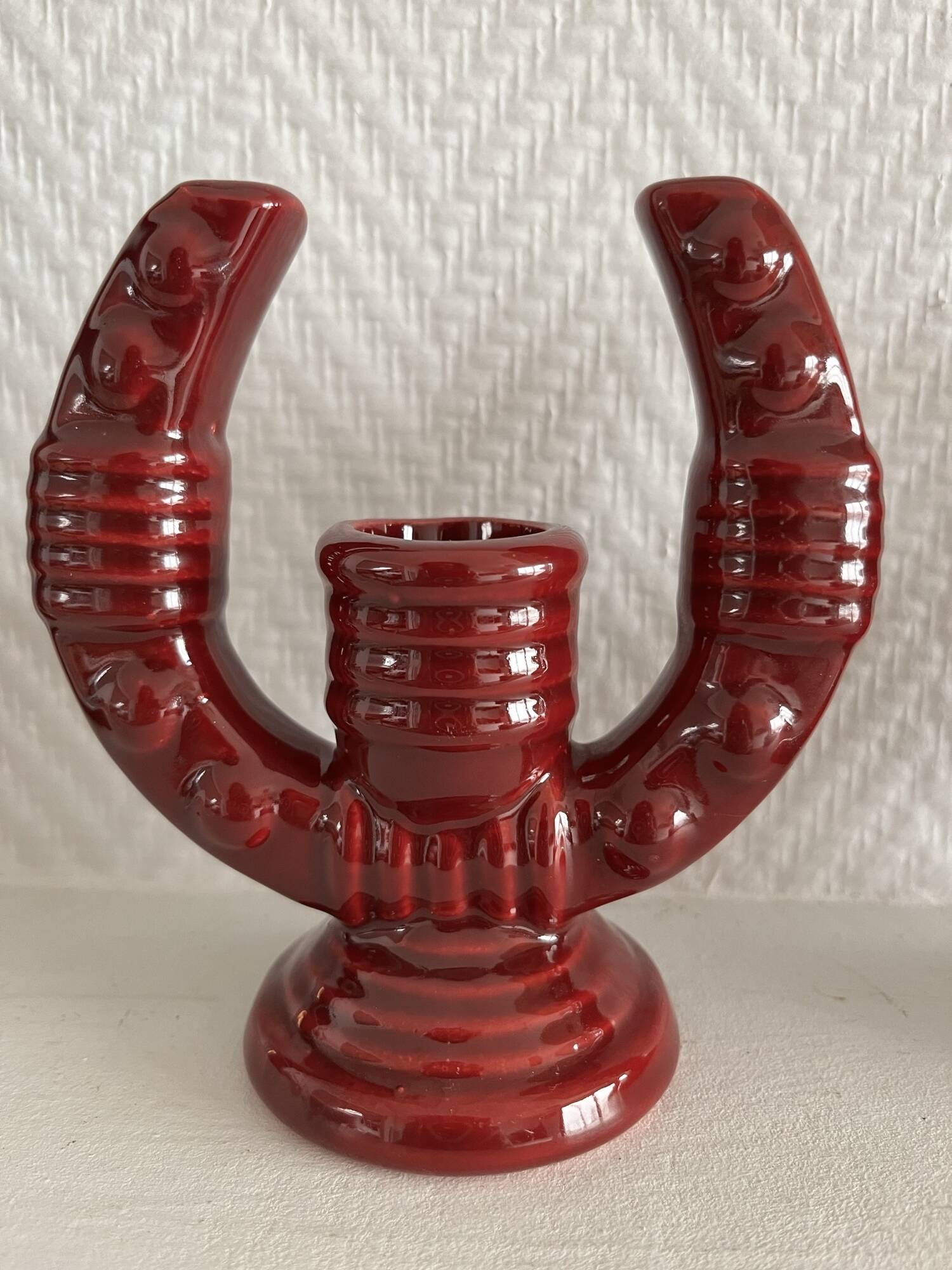 2 fifties red ceramic candle holders, horseshoe pattern