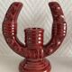 2 fifties red ceramic candle holders, horseshoe pattern