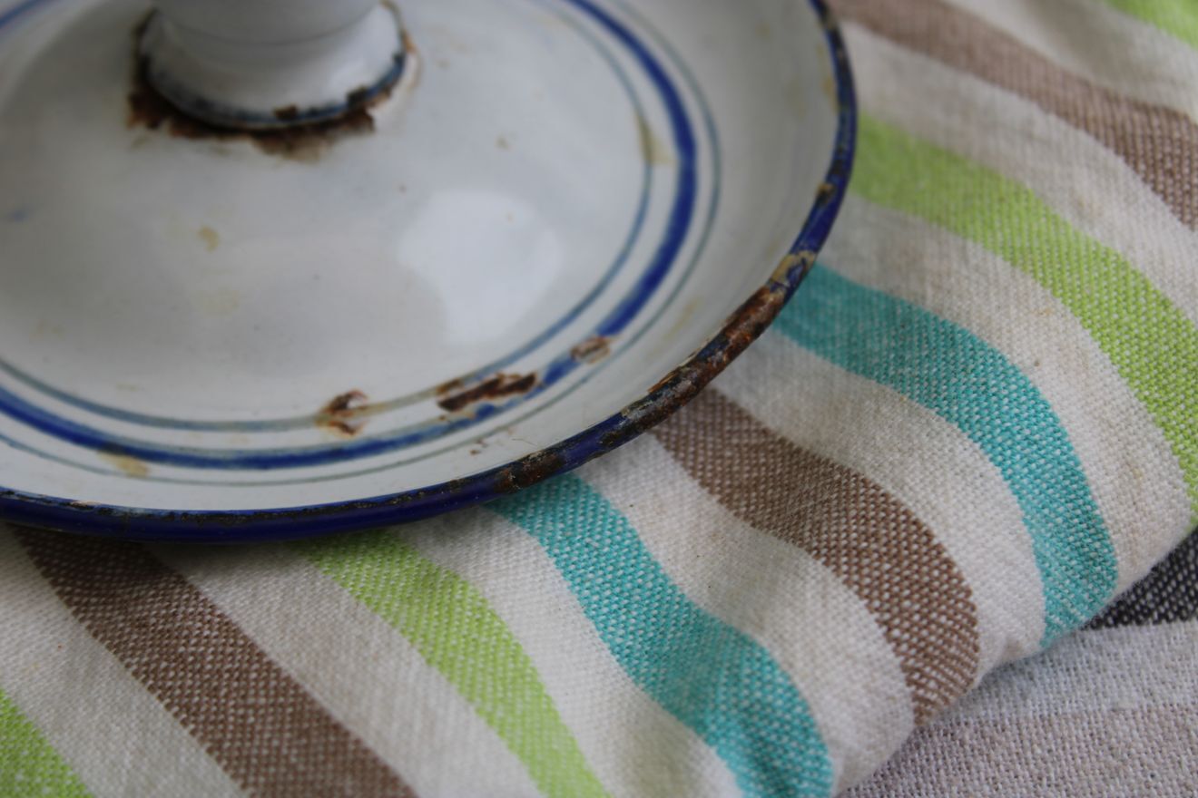 Old enamel candle holder