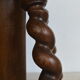 Antique piano stool with adjustable screws and turned wooden legs