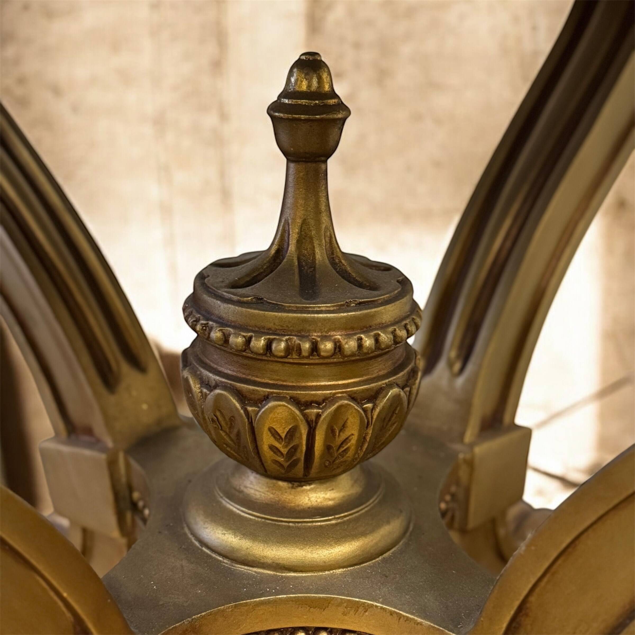 A round Louis XV style table in carved gilt beechwood with a black marble top