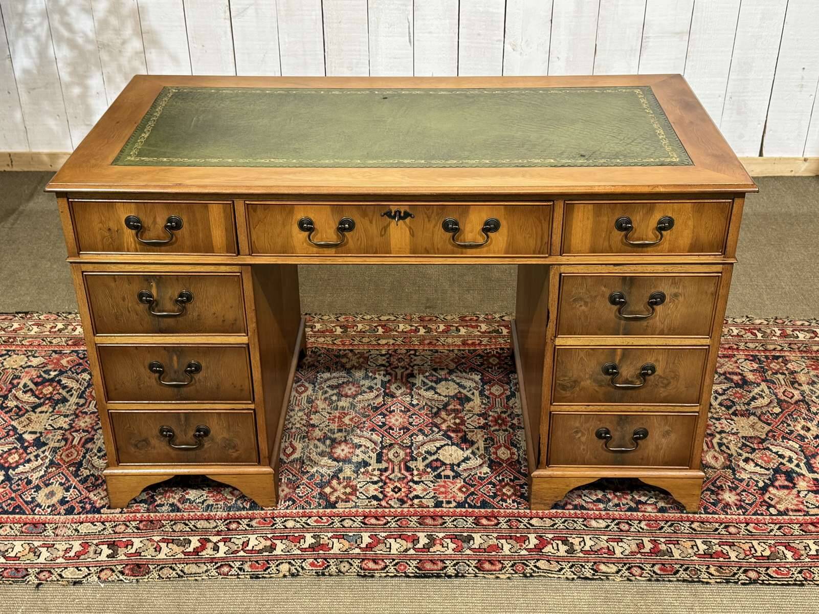 English flat desk with drawers from the 1970s in fir and leather top.