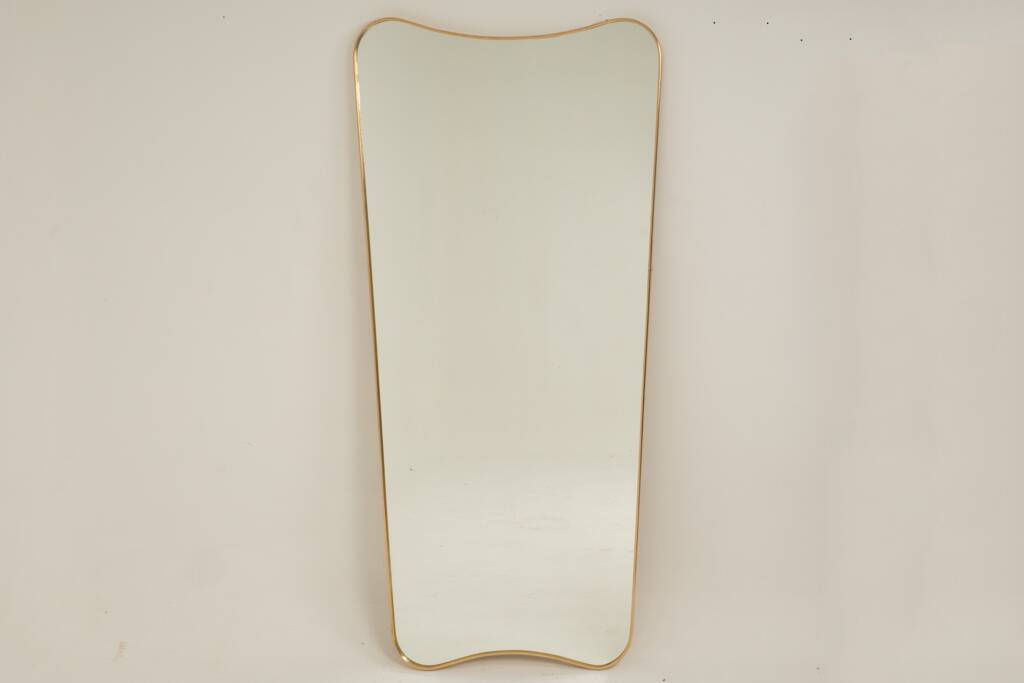 Patinated brass-framed mirror. 1980s/90s.