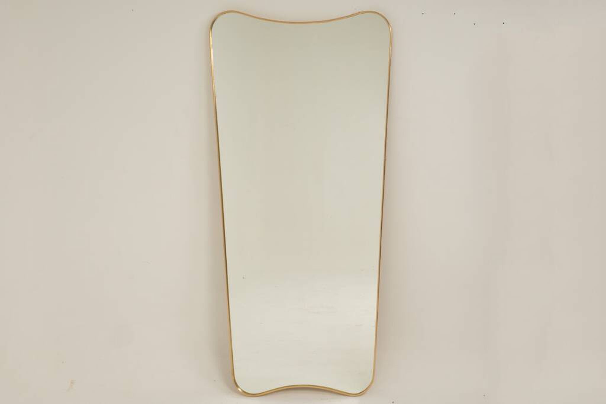 Patinated brass-framed mirror. 1980s/90s.