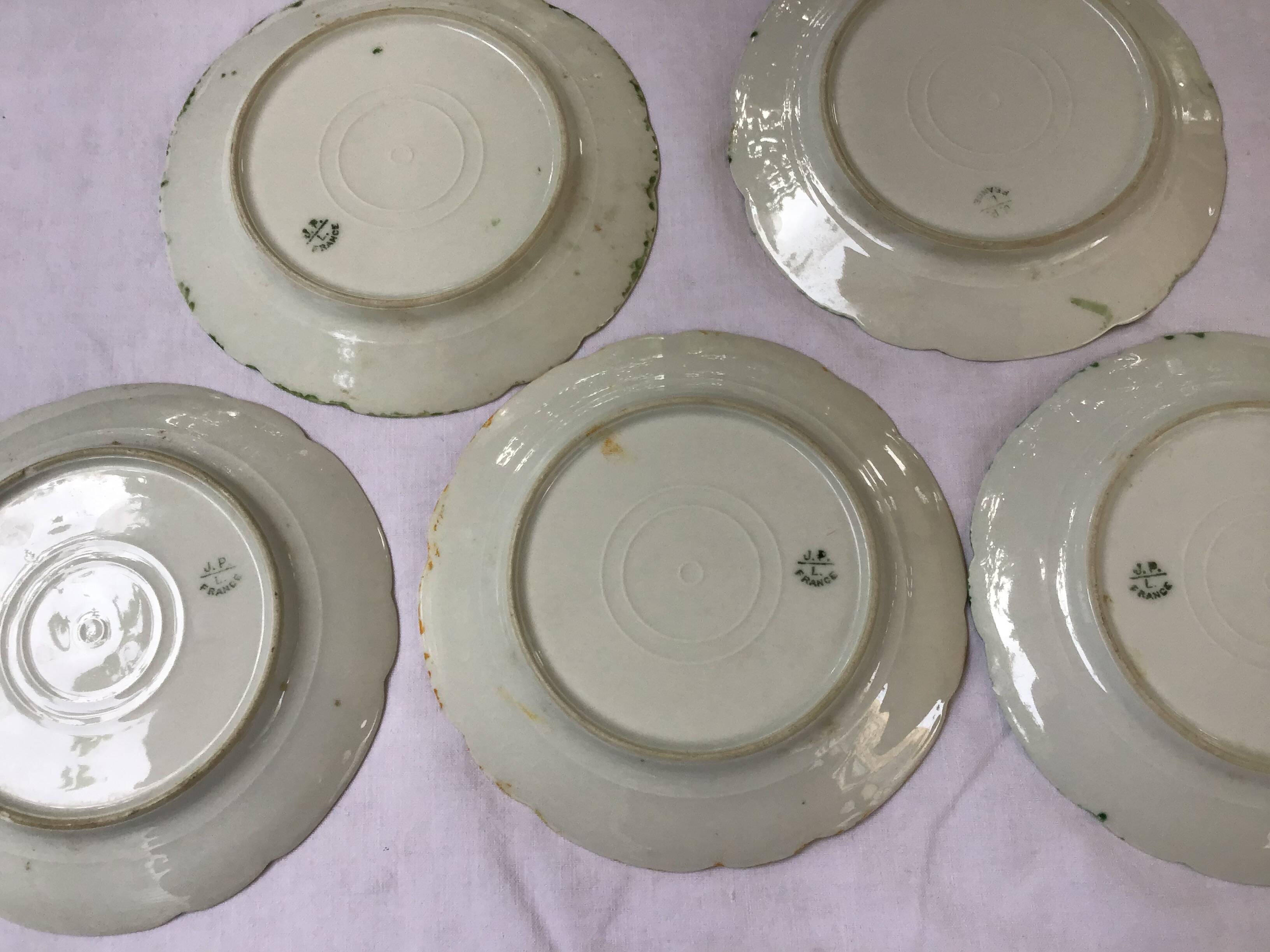 7 small plates in fine Limoges porcelain