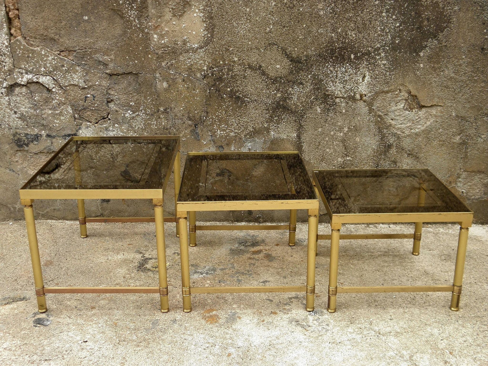 Brass, gold metal and 70s mirror glass tables