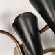A set of wall lamps in black lacquered metal with brass details