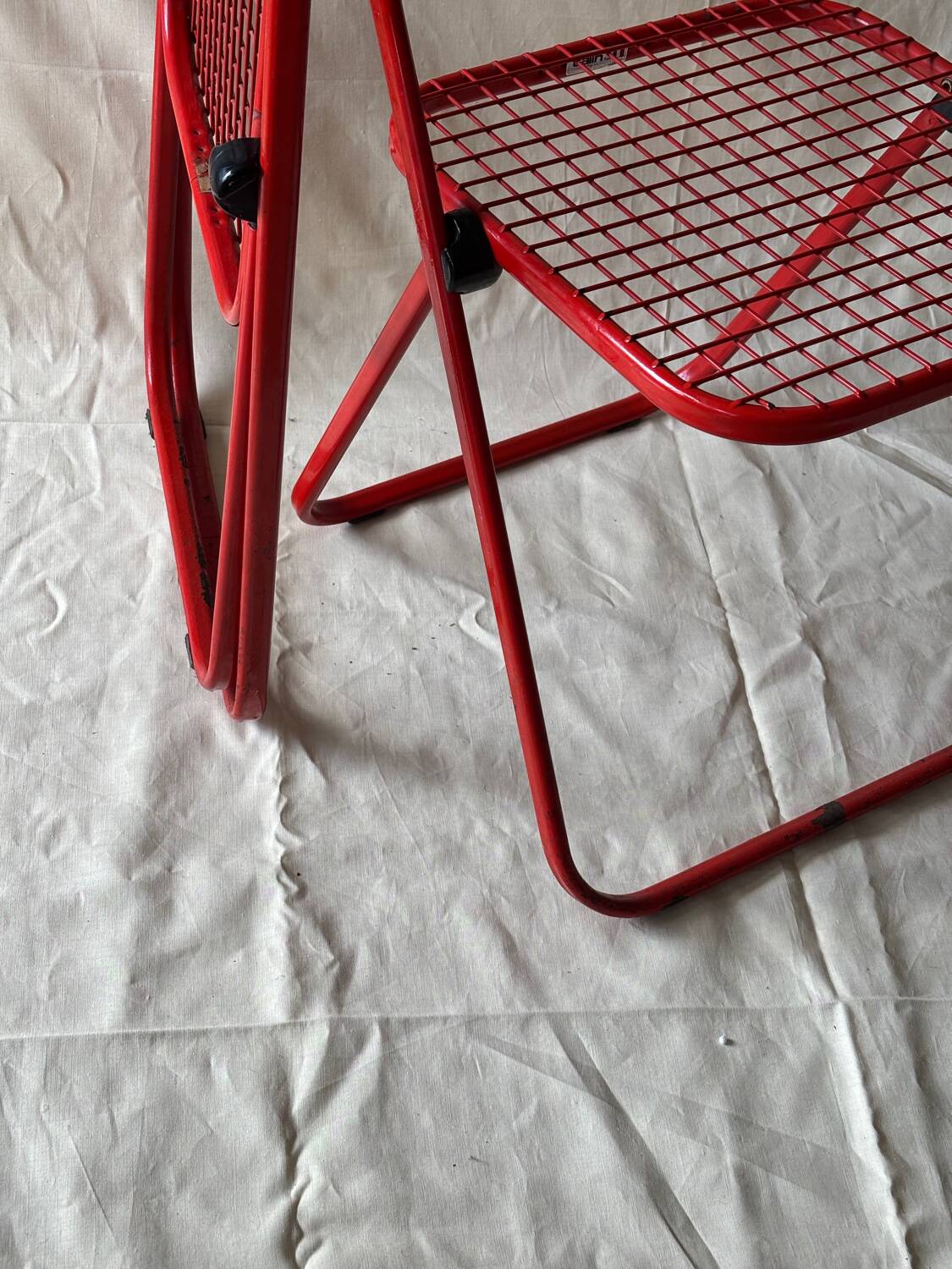 Red folding chairs Talin Italy, 1980