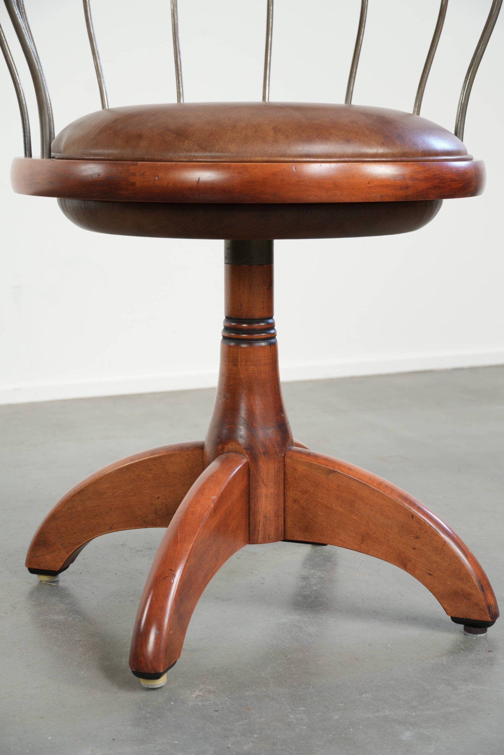 Swivel side chair / office chair with a cognac-coloured cow leather seat