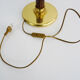 Mazda lamp in gilded metal, foot imitation wood and white opaline. Year 60
