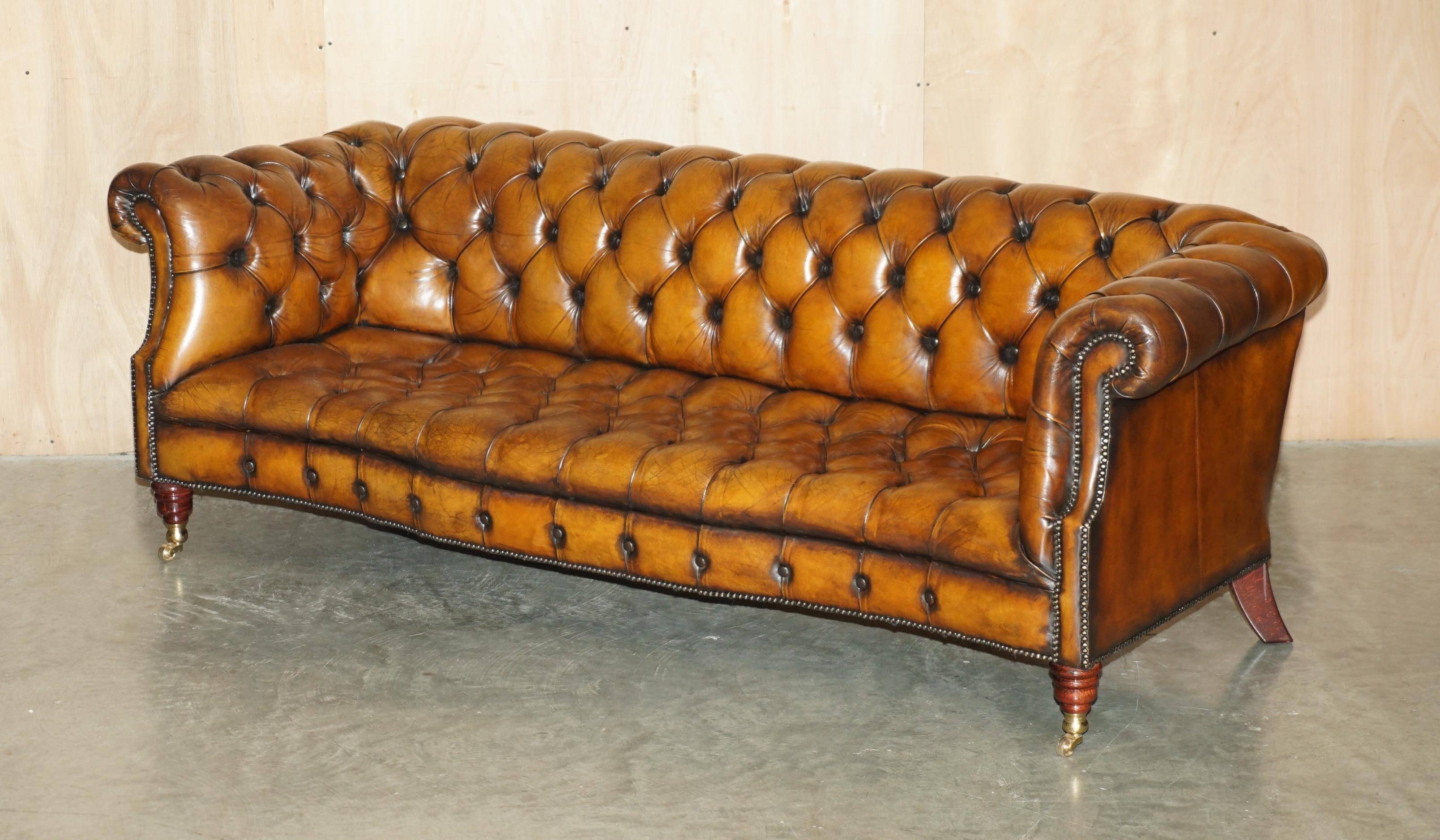 Vintage Chesterfield serpentine luxury sofa in restored leather
