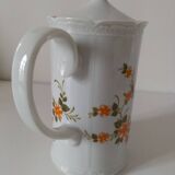 Vintage coffee pot Winterling Bavaria with orange floral decoration.