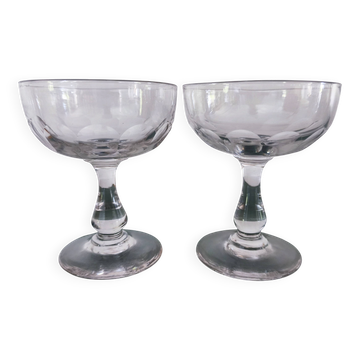 Set of 2 Baccarat crystal champagne glasses.