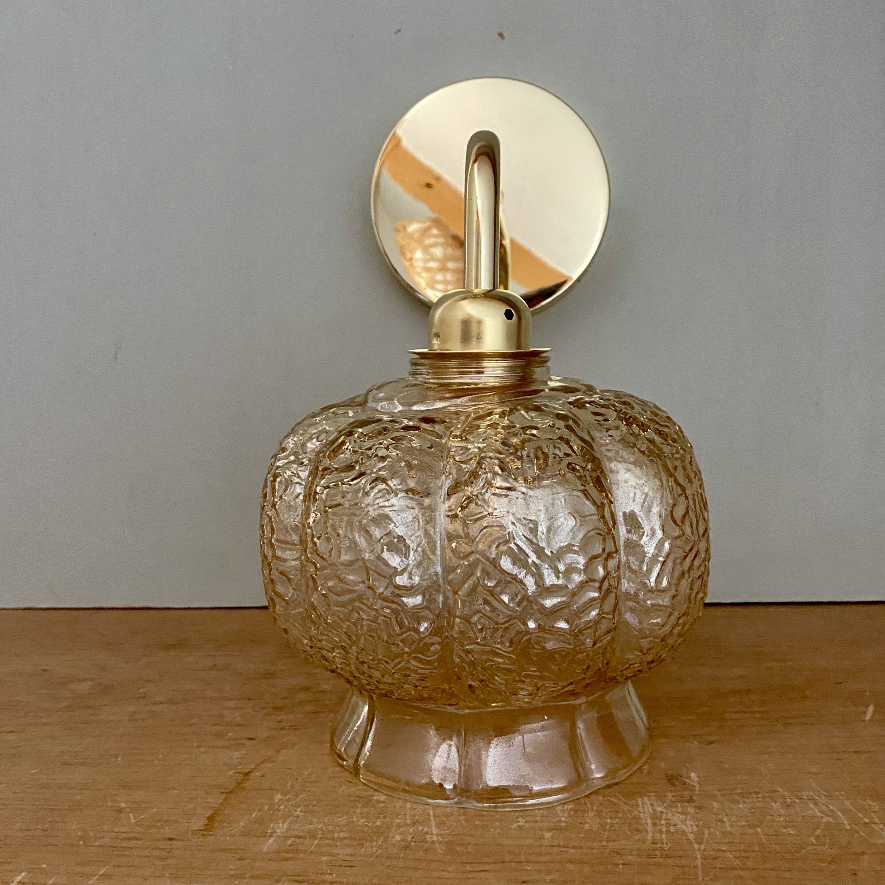 Vintage golden globe angled wall light in amber glass