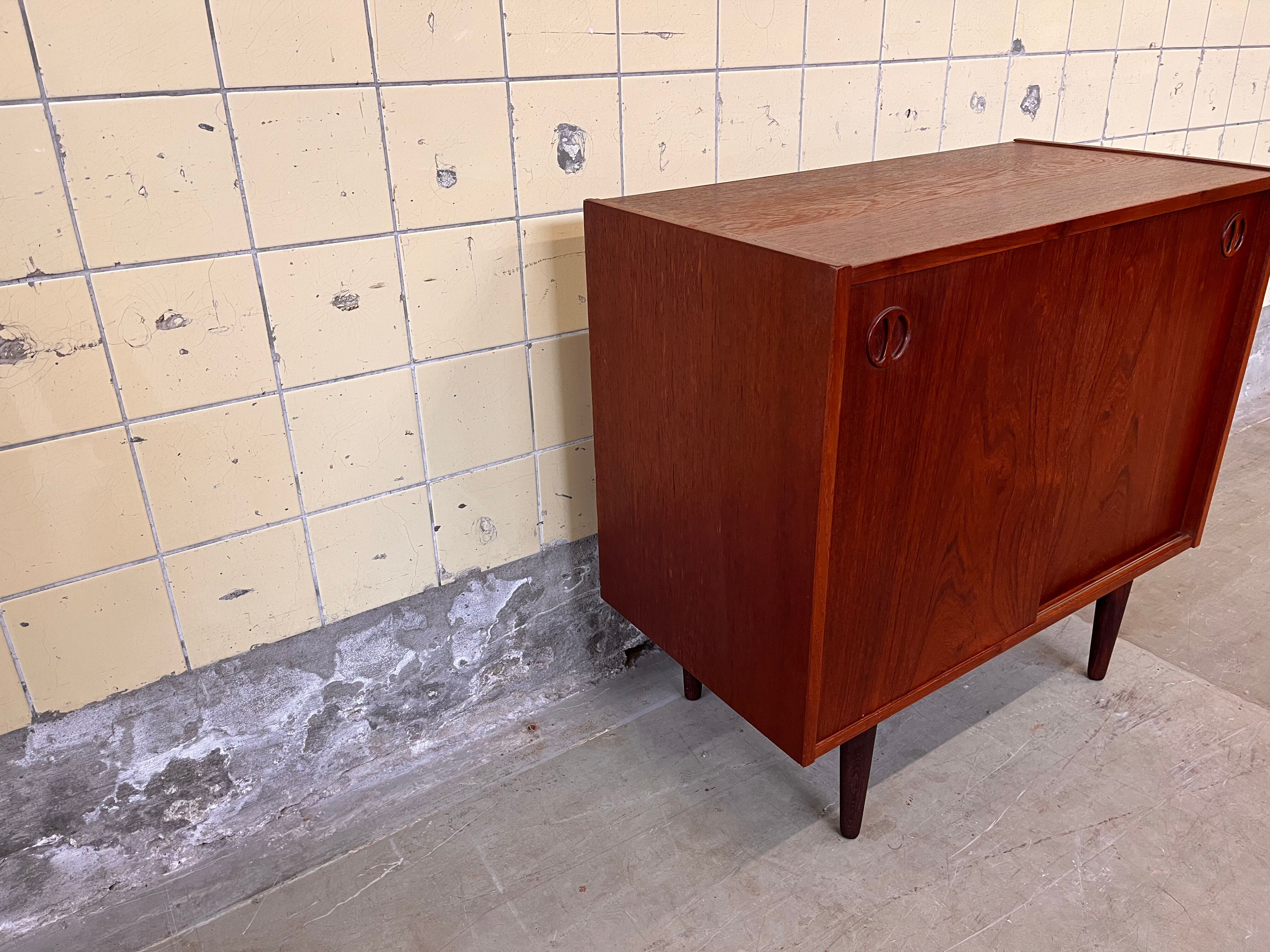 Vintage Danish cabinet with sliding doors