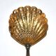 Empire sprinkling spoon in gilded silver vermeil and mother-of-pearl, 19th century.