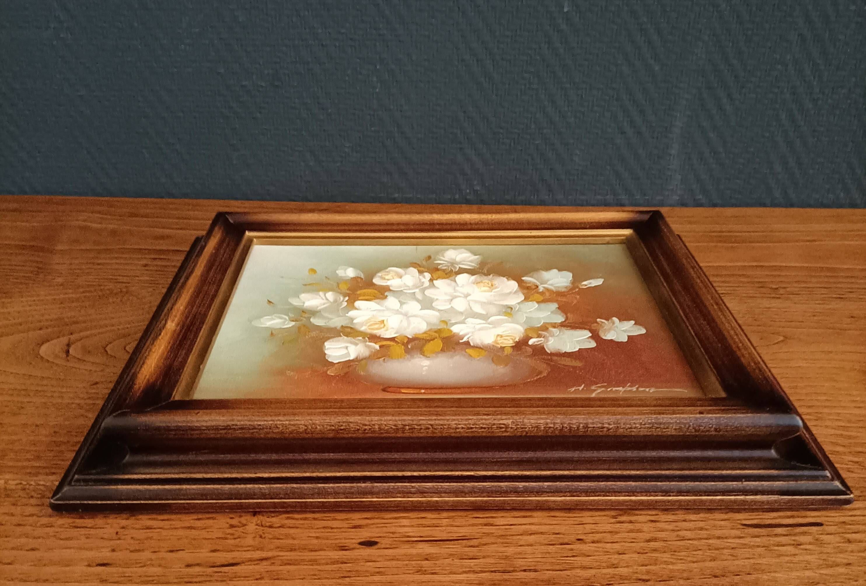 Still life painting with flowers, artist's signature
