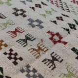 White carpet with multicolored Berber patterns handmade