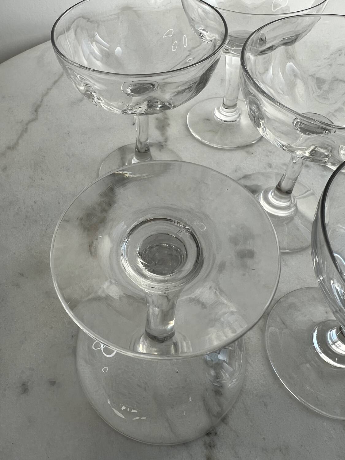 Set of seven blown glass stemmed glasses.
