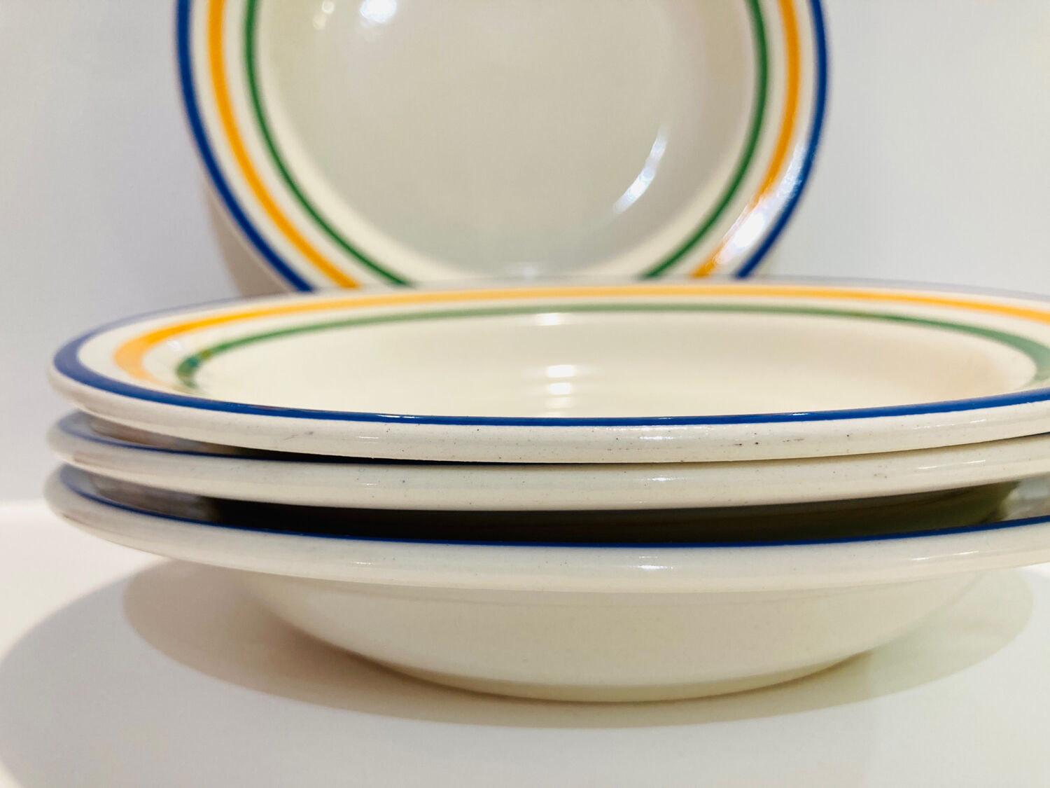4 hollow faience plates with stripes made in Romania