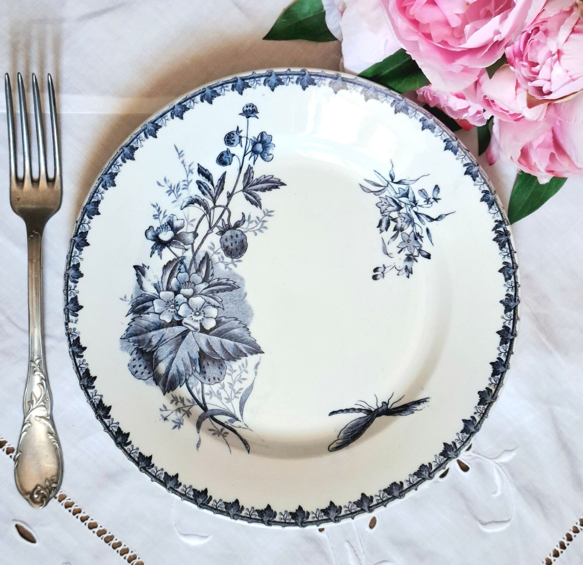 Old mismatched flat plates made of ironstone earthenware.