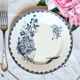 Old mismatched flat plates made of ironstone earthenware.