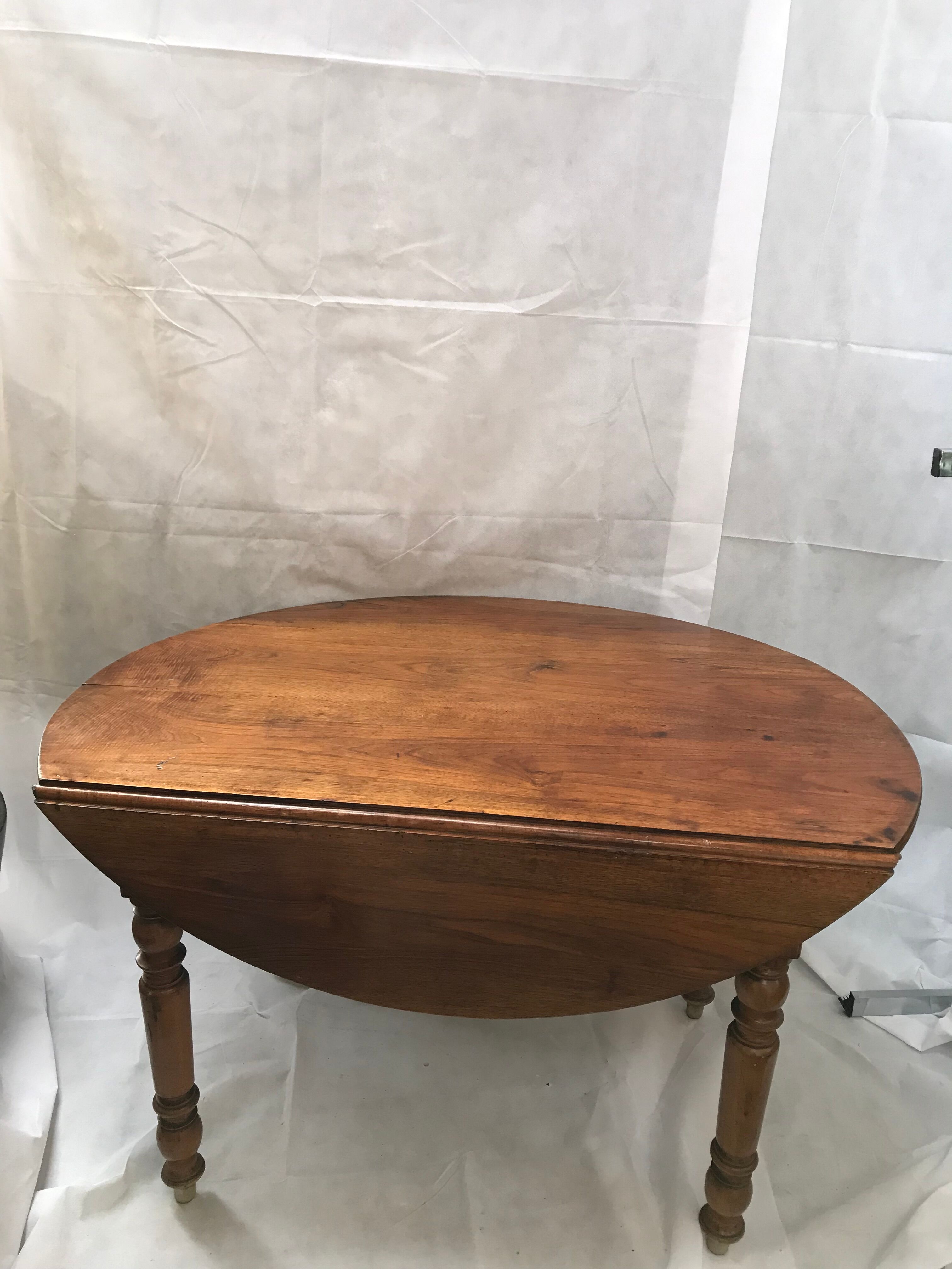 Oval wooden table with shutter